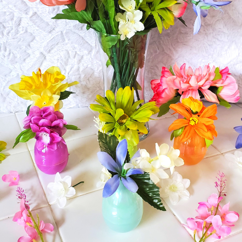These DIY Flower Egg Vases are the perfect spring decor DIY! With some plastic Easter eggs and faux flowers, your space will blossom for spring!