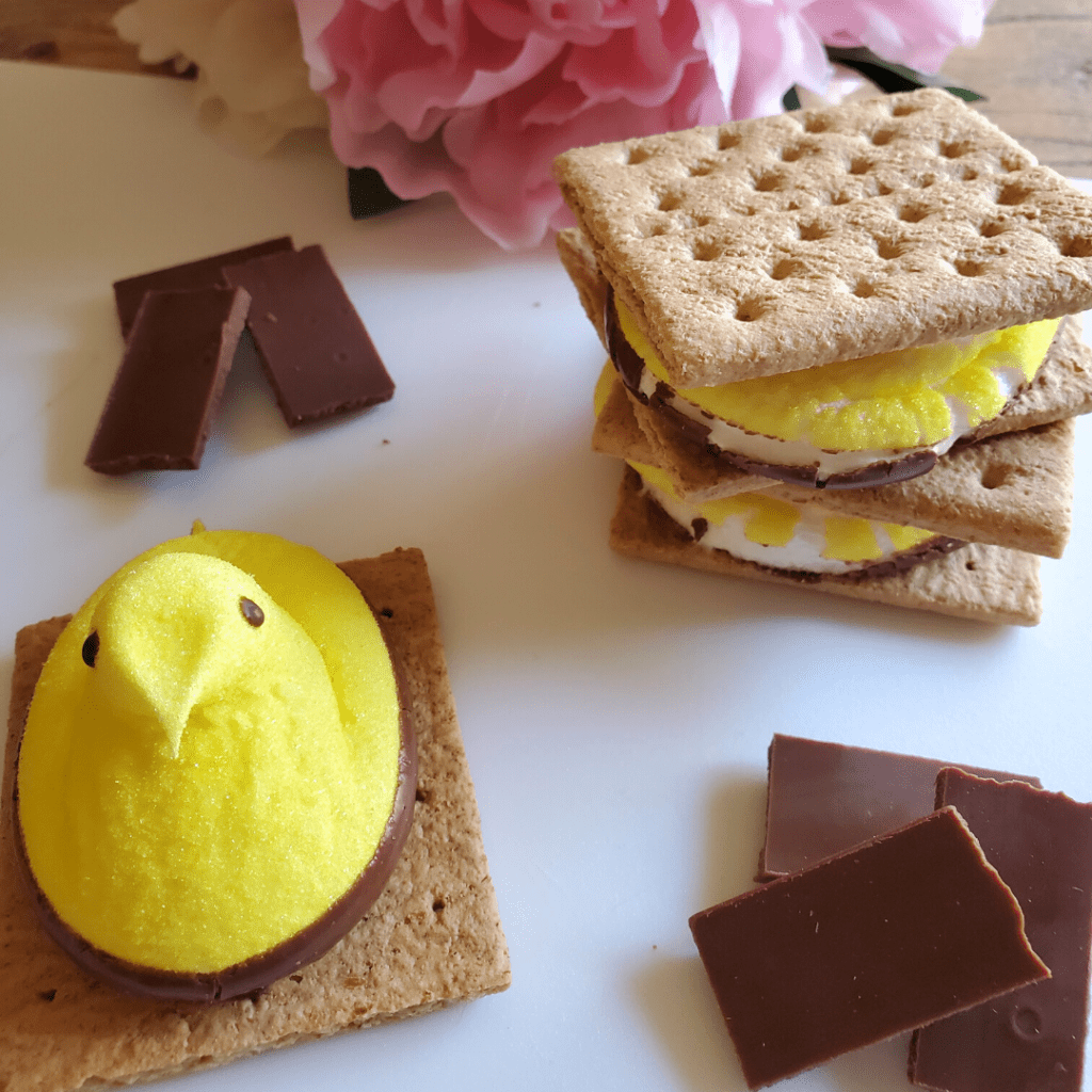These Peeps S'mores make for a quick and easy spring treat! Using chocolate-dipped Peeps marshmallows and graham crackers, you literally only need two ingredients to whip up some delicious s'mores! These Peeps S'mores also make for a fun spring treat for kids!