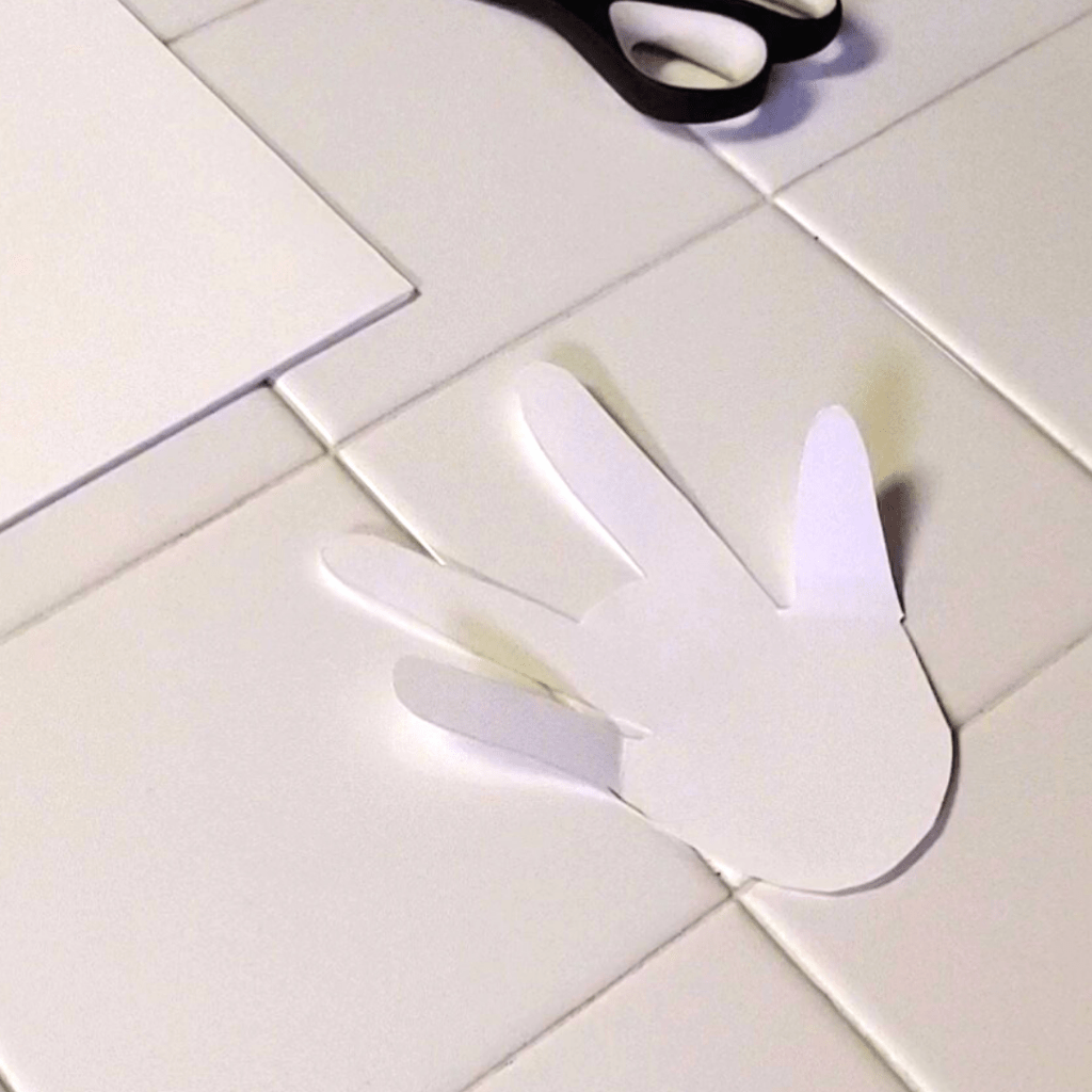 A fun and easy spring craft for families, these adorable bunnies are made out of your handprint!
Here, the base of the bunny's body is seen. 