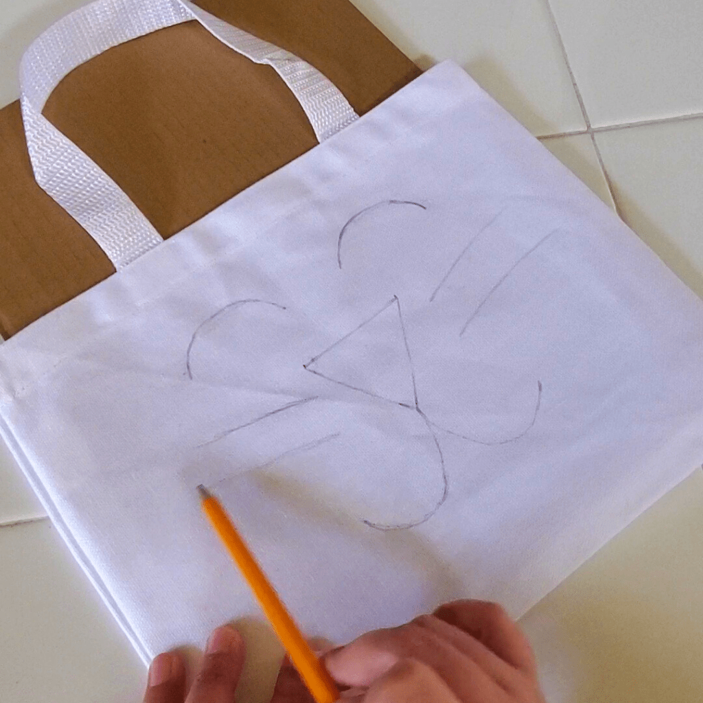 This DIY Bunny Bag is a fun spring statement piece and pairs perfectly with your spring or Easter outfit. Plus, this DIY Bunny Bag could easily be used as an Easter basket for kids to get their spring treats in and later use while Easter egg hunting!
Here, add some whiskers on either side of the bunny's face.